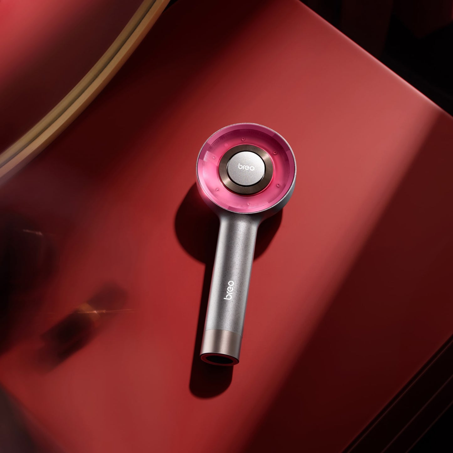 Breo S3 Scalp Massager with red light therapy for hair growth, silver handheld device