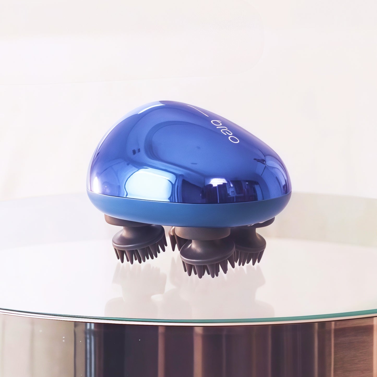 Breo Scalp Mini massager in blue, electric head massager for scalp massage and hair growth
