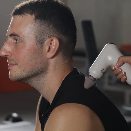Breo Gun 7 used on neck and shoulder, muscle recovery and relaxation, neck massager