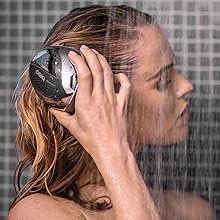 Breo Scalp Mini Pro being used in the shower; Waterproof electric scalp massager for hair growth