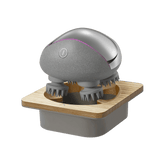 Breo Scalp Mini Pro: Cordless electric scalp massager on wooden base, promoting relaxation and hair growth.